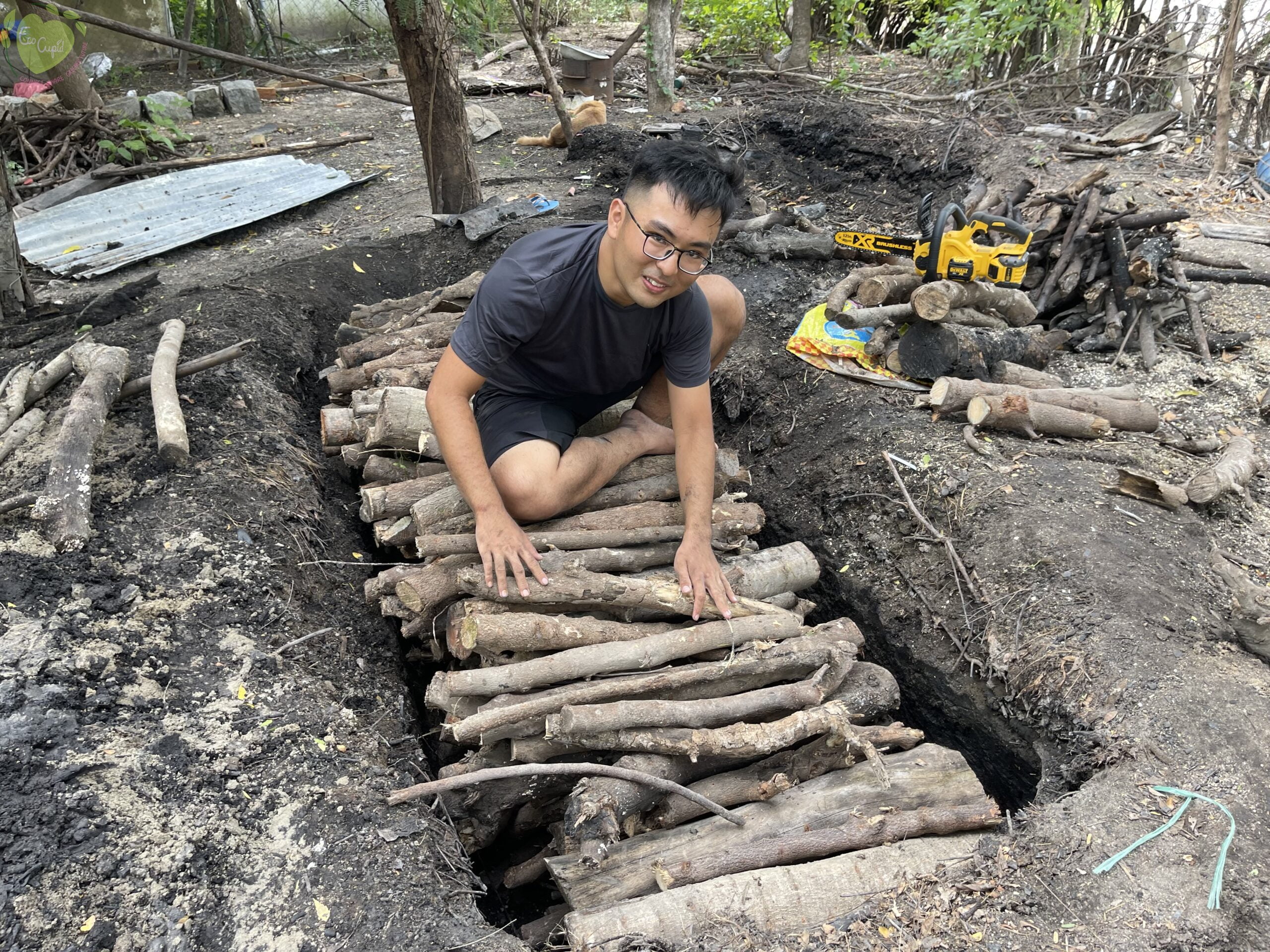 huy is learning to place the branches correctly into the pit.(Mr Jaka)