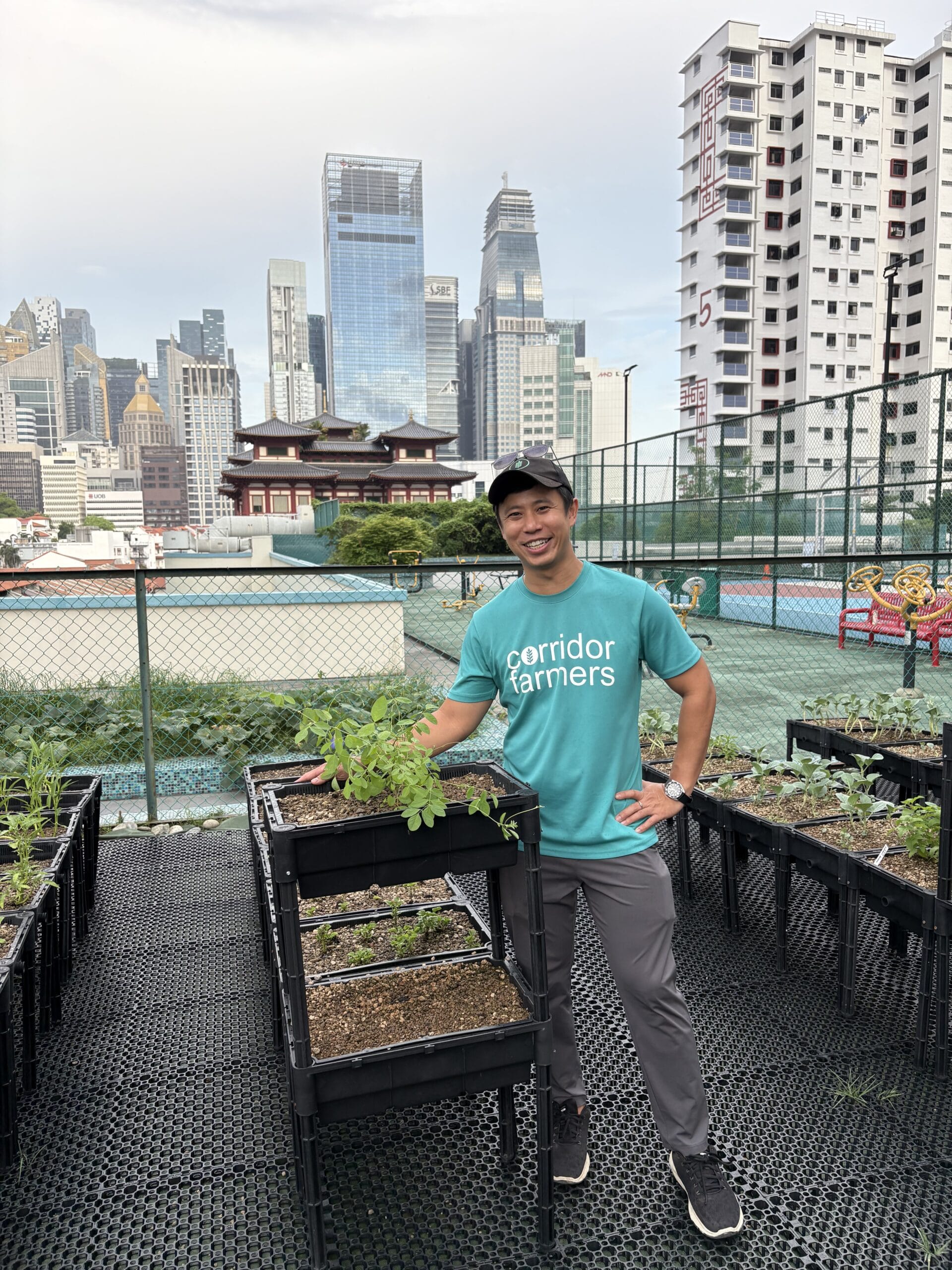 Corridor Farmers founder Roc Koh portrait in front of this rooftop farm