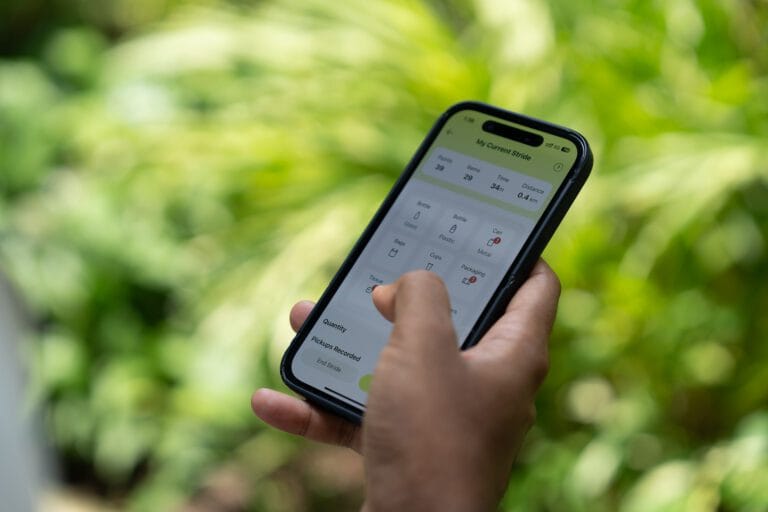 Hand using a phone app, showing Stridy's app